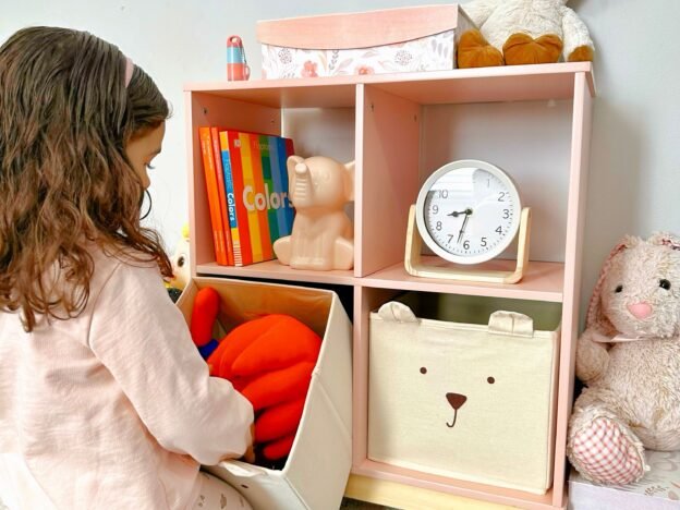 kid is organizing her rack